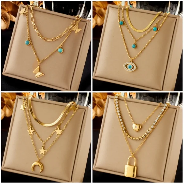 قلادة من DIEYURO مصنوعة من الفولاذ المقاوم للصدأ بتصميم فراشة وقفل القمر وعيون زرقاء