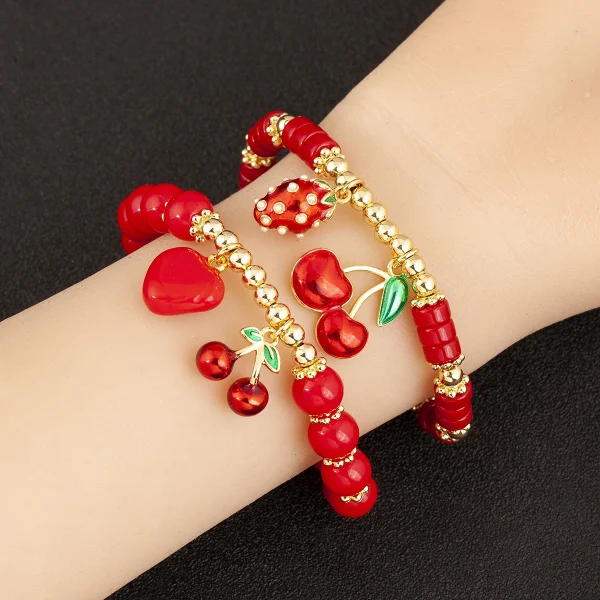 سوار من Nidin بتصميم على شكل الكرز والقلب مع خرز أحمر