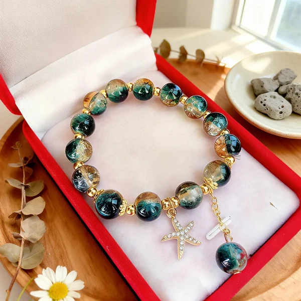 سوار مصنوع يدويًا من خرز كريستالي بتدرجات اللون الأزرق