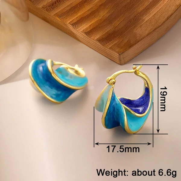 اقراط ذهبية ملونة