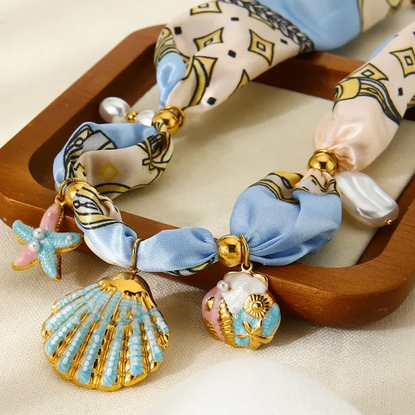 عقد نسائي من INS على طراز المحيط، مزين بتعليقة نجمة بحر وصدفة مطلية بالمينا الملون