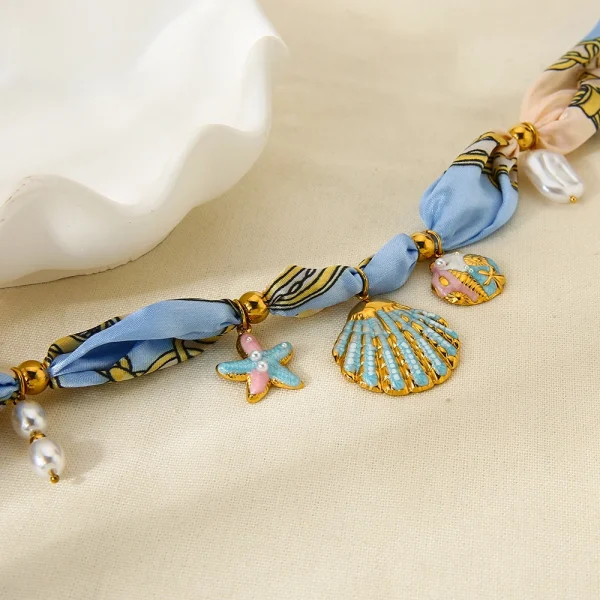 عقد نسائي من INS على طراز المحيط، مزين بتعليقة نجمة بحر وصدفة مطلية بالمينا الملون