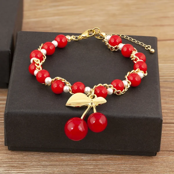سوار من Nidin بتصميم على شكل الكرز والقلب مع خرز أحمر