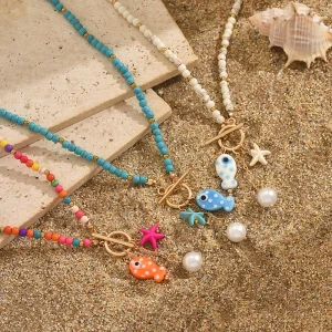 قلادة السمكة من السيراميك ملونة ومصنوعه يدويًا من خرز الؤلؤ ونجمة البحر